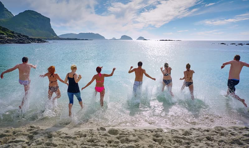 Group of people on a beach celebrating